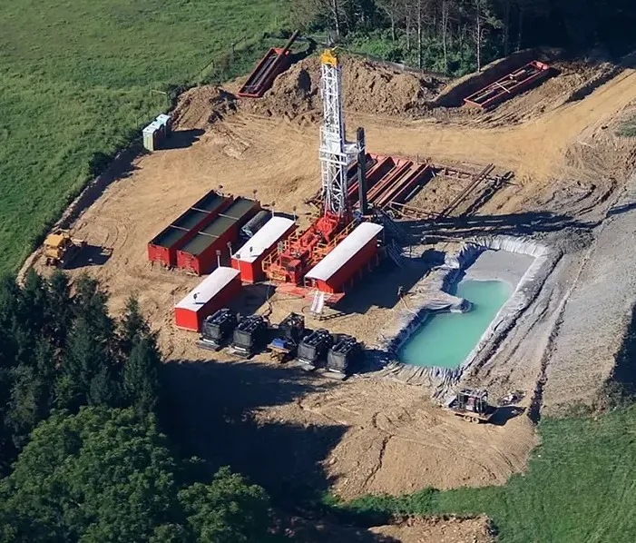 onshore oil and gas drilling site in a rural landscape